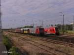145 CL 001 zieht in Eisenhttenstadt mit ein Kohlezug am RE vorbei.