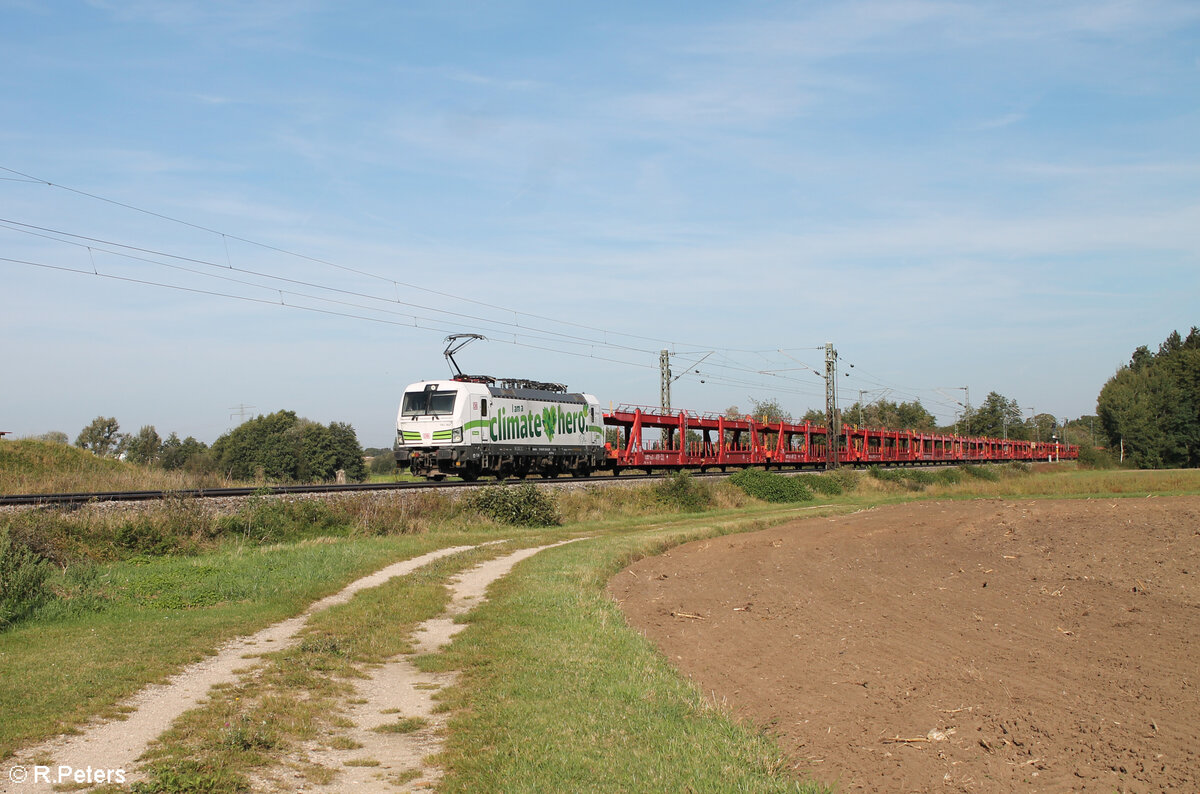 193 363  I am a Climate Hero  zieht den leeren Autozug nach Hegyeshalom kurz vor Postbauer-Heng. 22.09.24
