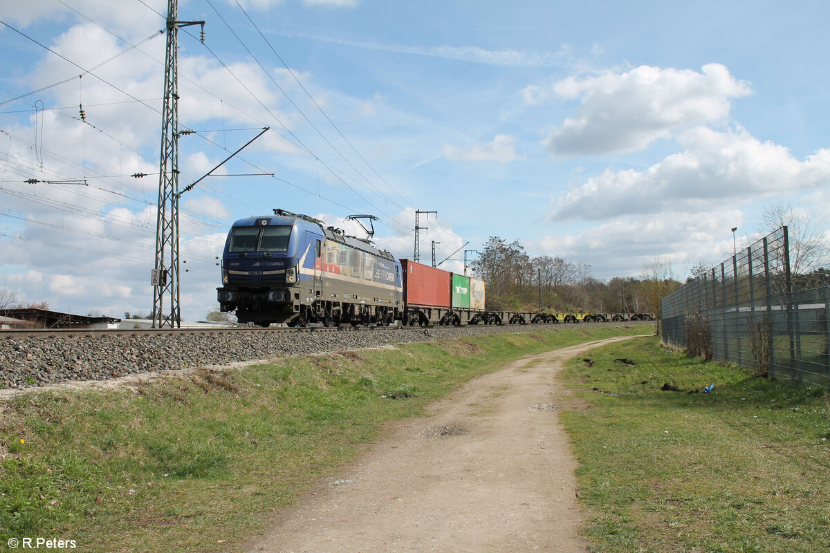 193 565-9  Evolution  mit fast leeren Containerzug in der Treuchtlinger Kurve in Nürnberg Hohe Marter. 25.03.24