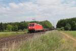 185 272-2 zieht einen gemischten Güterzug bei der Stromkreistrennstelle Bischofsheim.