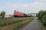 185 069-2 zieht bei Nauheim einen gemischten Güterzug in Richtung Mainz.