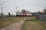 186 385-1 mit einem Containerzug in der Treuchtlinger Kurve in Nürnberg Hohe Marter. 18.02.24