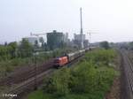 1116 010 erreicht regensburg mit ein gedeckten Güterzug.