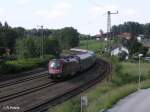 1116 210 schiebt den Railjet 69 Wien Westbahnhof durch Hellwang-Elixhausen.